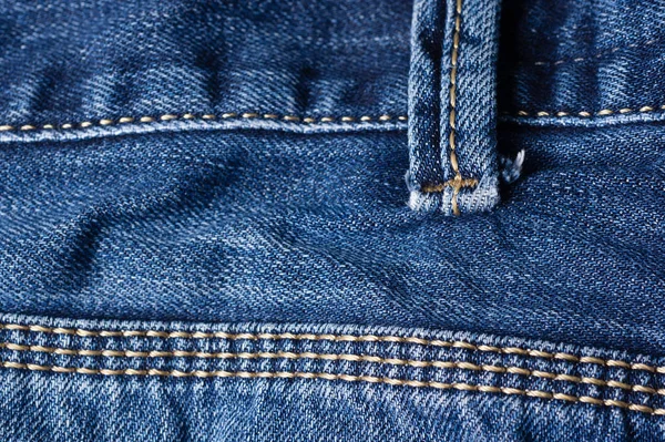 Jeans close-up, seams, belt loops. Interlacing the fabric with a — Stock Photo, Image