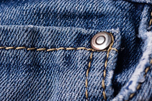 Jeans close-up. Clasps, pocket, seams. Interlacing the fabric wi — Stock Photo, Image