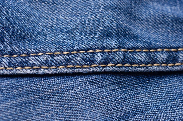 Jeans aus nächster Nähe. Nähte. Verflechtung des Gewebes mit einer Nahaufnahme — Stockfoto