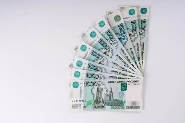 A stack of thousand-ruble banknotes, spread out money. Russian c — Stock Photo, Image