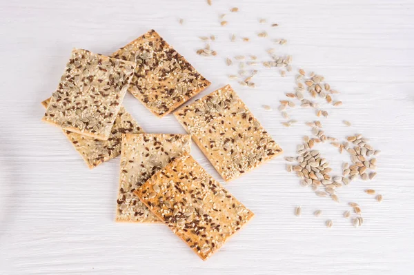 Stack of crispy wheat cakes with sesame, flax and sunflower seed — 스톡 사진