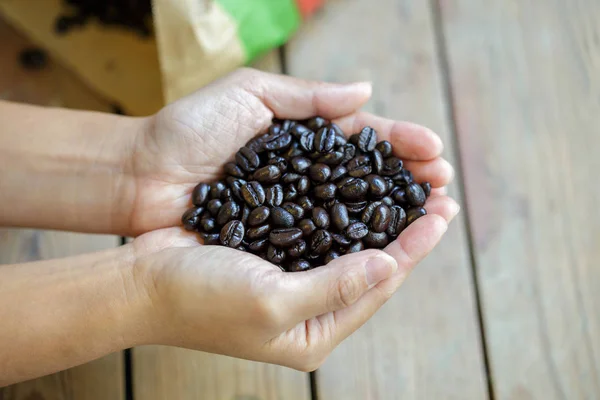 Coffee beans on the hand. — Stock Photo, Image