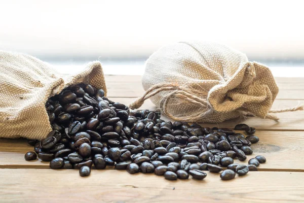 Coffee beans out of the sack. — Stock Photo, Image
