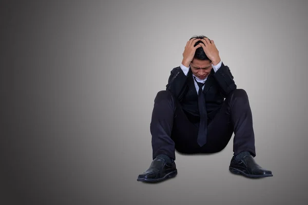 Businessman sit and hold his head with despair. — Stock Photo, Image