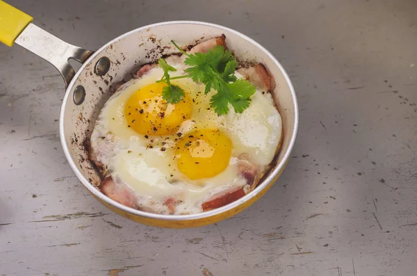 Two fried eggs in a frying pan