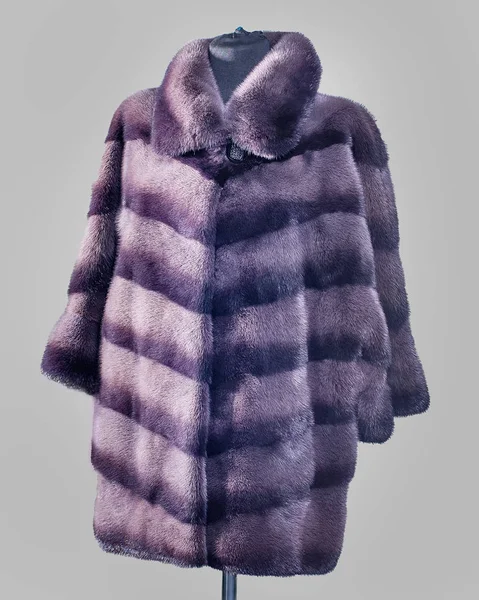 Mink jacket dyed mink lilac color with dark stripes close-up,