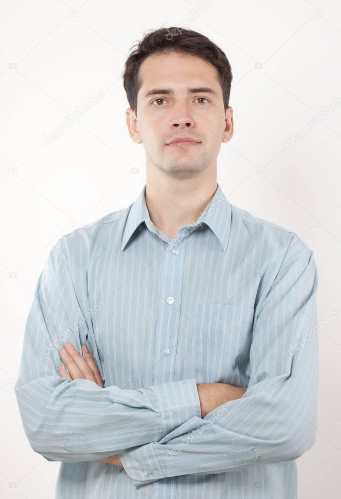 Handsome young serious man in shirt