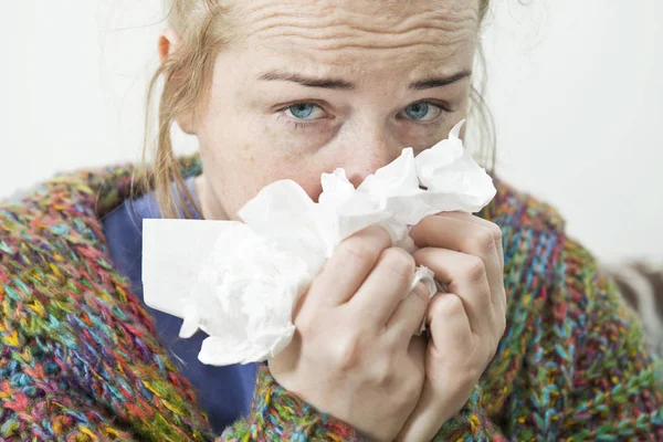 Sick woman. Sneezing into tissue. Headache. Virus .Medicines
