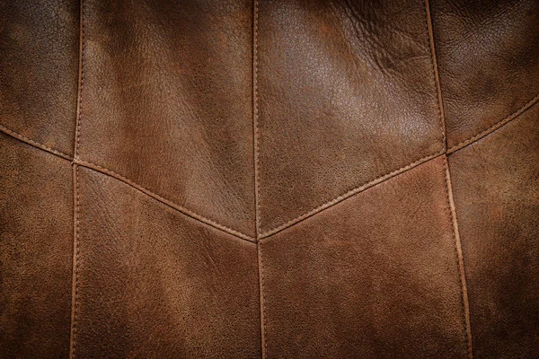Textuur oude noodlijdende gestikte bruin leren jassen — Stockfoto