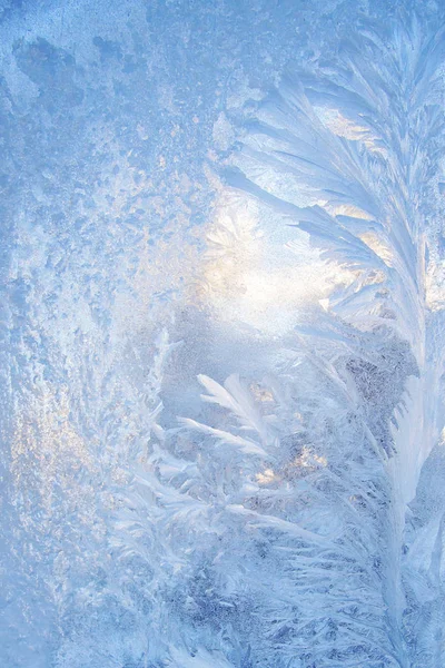 Christmas background with a frosty pattern on glass — Stock Photo, Image