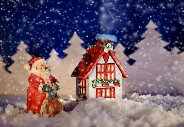 Vánoční obrázek zimní chata a Santa — Stock fotografie