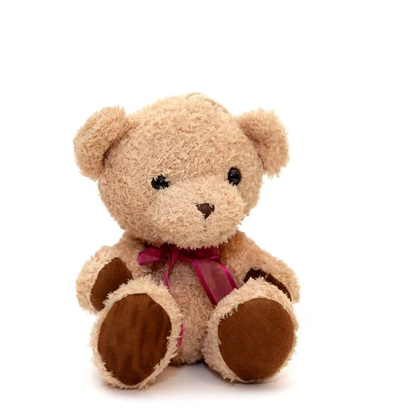 Teddybeer met een rode strik op haar nek op een geïsoleerde achtergrond — Stockfoto