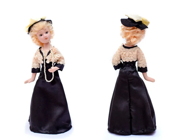 Porseleinen pop in zwarte jurk en muts, voorzijde en achterzijde — Stockfoto
