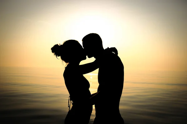 Couple kissing on the beach