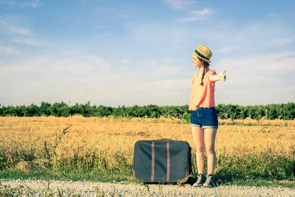 Girl doing hitchhiking — Stock Photo, Image