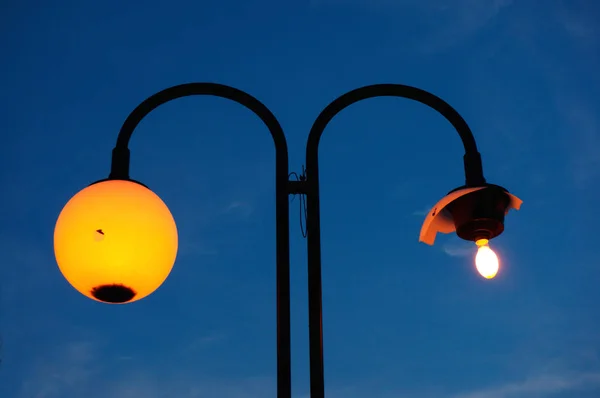 street lamp with a broken shade