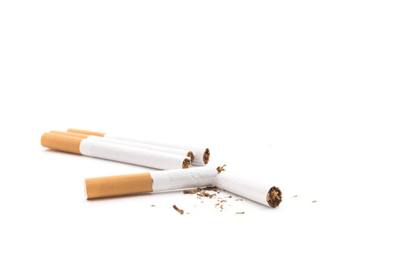 Broken cigarette and tobacco isolated on white background