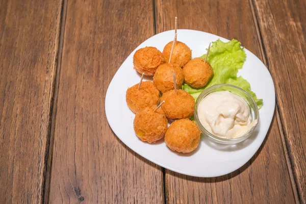 Cheese balls with sauce