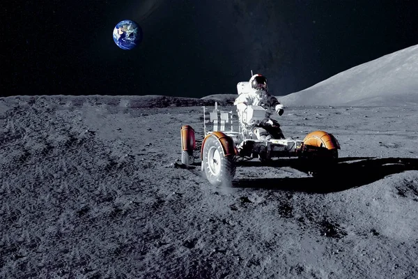 Astronaut near the moon rover on the moon. With land on the horizon. Elements of this image were furnished by NASA. — Stock Photo, Image