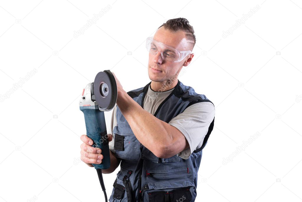 The builder in goggles, with an angle grinder in his hands.