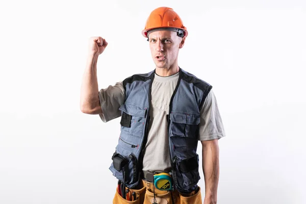 O construtor aperta um punho apertado, e implica um sinal de sim . — Fotografia de Stock