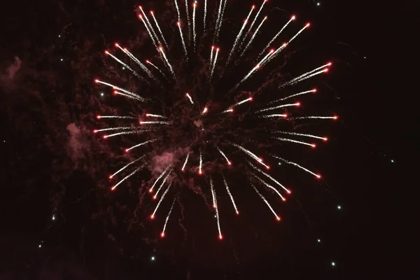 Beautiful inexpensive red fireworks against the dark sky. With smoke. — 스톡 사진