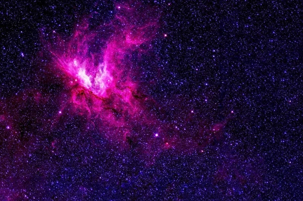 A pink galaxy in deep space. Elements of this image were furnished by NASA.