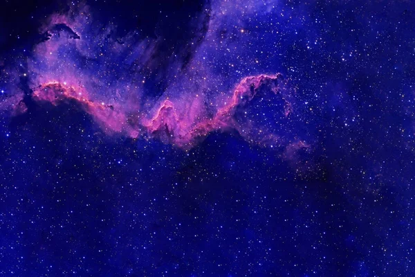 Una galassia blu con stelle nello spazio profondo. Elementi di questa immagine sono stati forniti dalla NASA . — Foto Stock