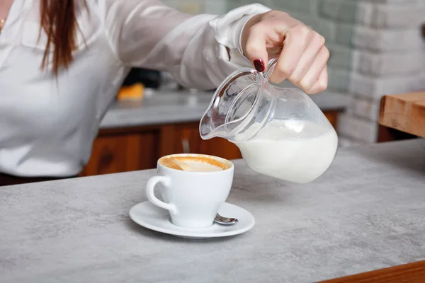 cup of coffee with milk on the table