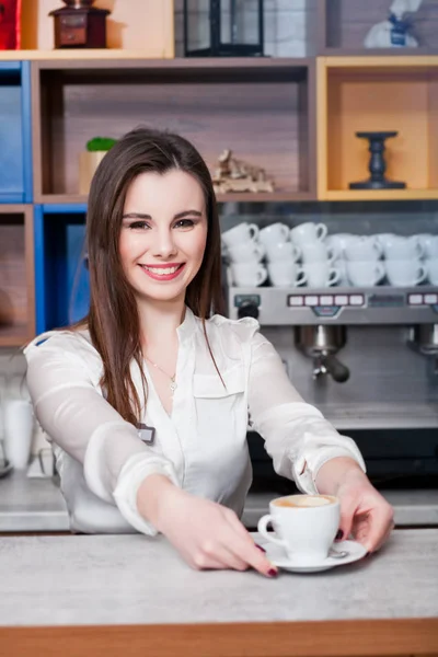 Young girl preparing coffee in a cafe barista — Stock Photo, Image