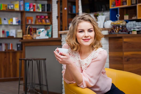 Pretty young girl alone in the cafe — Stock Photo, Image