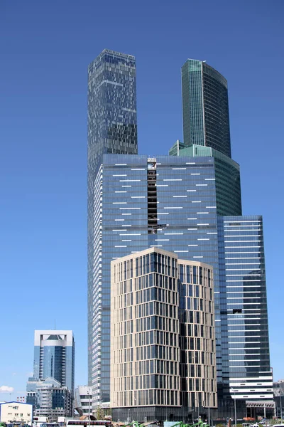 Skyscraper of metal and glass in a big city near the river — Stock Photo, Image