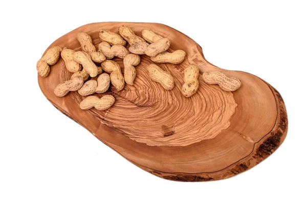 Peanuts in a shell on a wooden board isolated on a white background — Stock Photo, Image