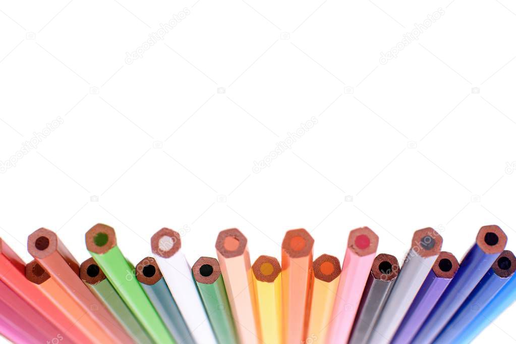 Many colored pencils isolated on white background, place for text