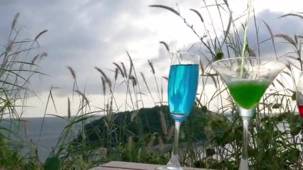 Drinks on hill top in front of wind turbine view point — Stock Video