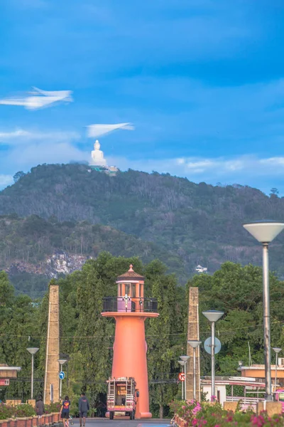 behind lighthouse at Chalong pier can see big Buddha on the hilltop