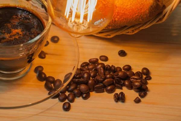 Transparent coffee cup and on pinewood table. — Stock Photo, Image