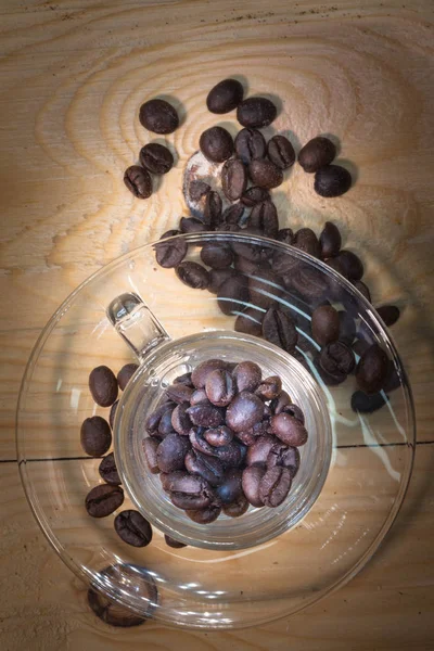 Top view of coffee beans in transparent cup — Stock Photo, Image