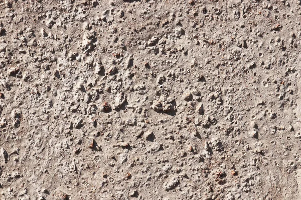 Textura de parede de concreto com estrutura de pedras — Fotografia de Stock