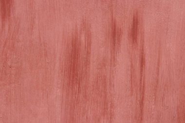 Duvar doku eski yıpranmış kırmızı boyalıdır. Fırça darbeleri.