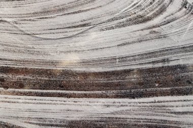 Buz yüzey arka plan doku. Donmuş gölde buz satırlarının dalgalı çizimler.