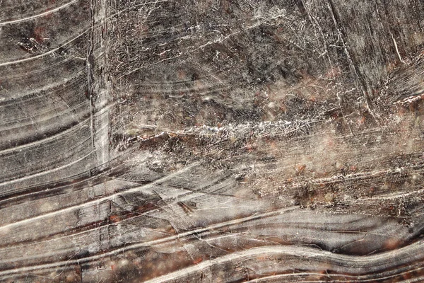 Eisfläche Hintergrund Textur. Wellenzeichnungen von Eislinien auf einem zugefrorenen See. — Stockfoto