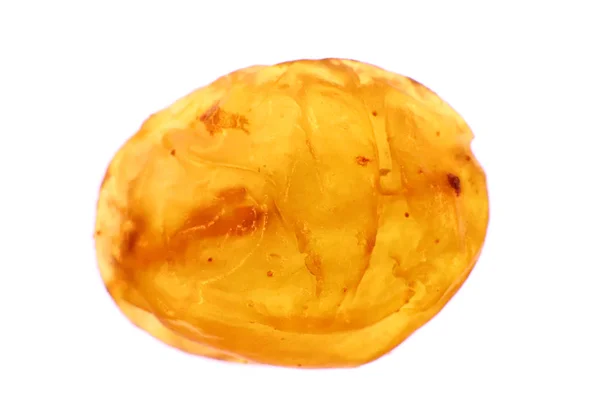 Şeffaf sarı altın kuru üzüm doku izole. Kuru meyve arka plan. Makro bakış. — Stok fotoğraf