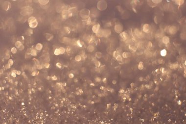 Kar yüzey Bokeh doku. Bulanık Noel Glitter arka plan. Kış sıcak zemin.