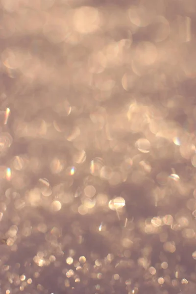 Bokeh textury. Teplá zimní pozadí. Glitter pozadí rozmazané vánoční. — Stock fotografie