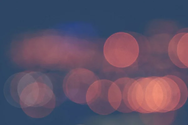 Unfocused evening lights. Yellow circles bokeh background. Blurred colored circles backdrop.