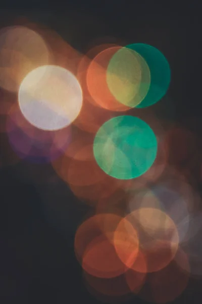 Yellow green circles bokeh background. Blurred colored circles backdrop. Unfocused evening lights.