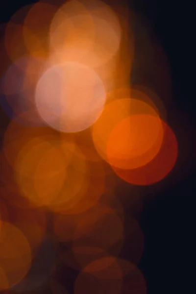 Blurred colored circles backdrop. Unfocused evening lights. Yellow circles bokeh background. — Stock Photo, Image