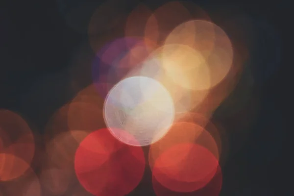 Yellow red rcircles bokeh background. Blurred colored circles backdrop. Unfocused evening lights. — Stock Photo, Image