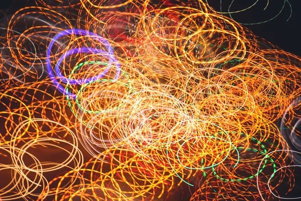Circles lights trails dynamic backdrop. Night exposure motion lines texture. Light traces background.